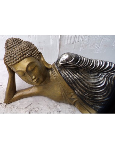 Buddha sdraiato in resina veste color argento...