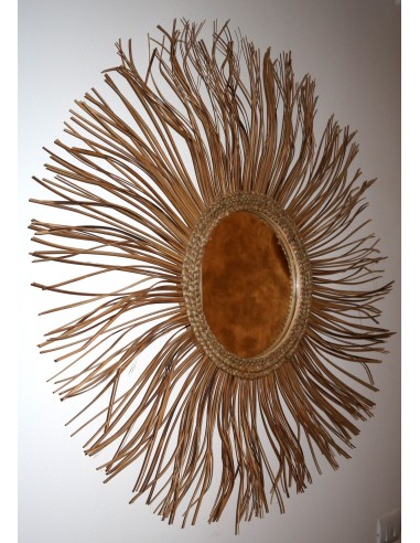 Specchio in rattan naturale a forma di un sole...